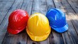 © DigitalDruid - A close up view of three vibrant construction helmets in red yellow and blue arranged on a wooden surface symbolizing safety and preparedness at a construction site