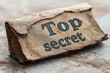 © Dmitriy - Top secret documents on table close up background.