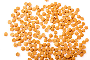 Top view of crunchy brown bone shaped dog biscuit as a treat set isolated on white background close up