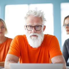 Focused senior man in orange shirt during a meeting