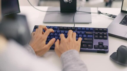 Wall Mural - a close-up view captures a programmer's hands as they swiftly navigate a mechanical keyboard, reflec