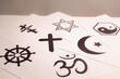 © doidam10 - Concept of interfaith dialogue promotes understanding and spirituality by bringing together symbols, beliefs from diverse religions Hinduism, Islam, Judaism, Buddhism, faith and religious harmony.