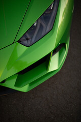 Wall Mural - Headlight of modern luxury supercar. Close up detail vertical shot