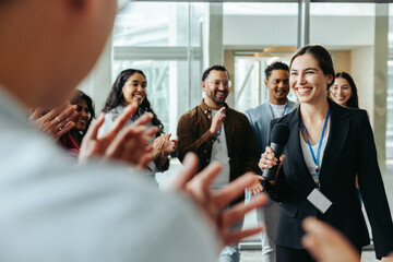female leader receives applause in a successful business meeting, showcasing effective leadership an