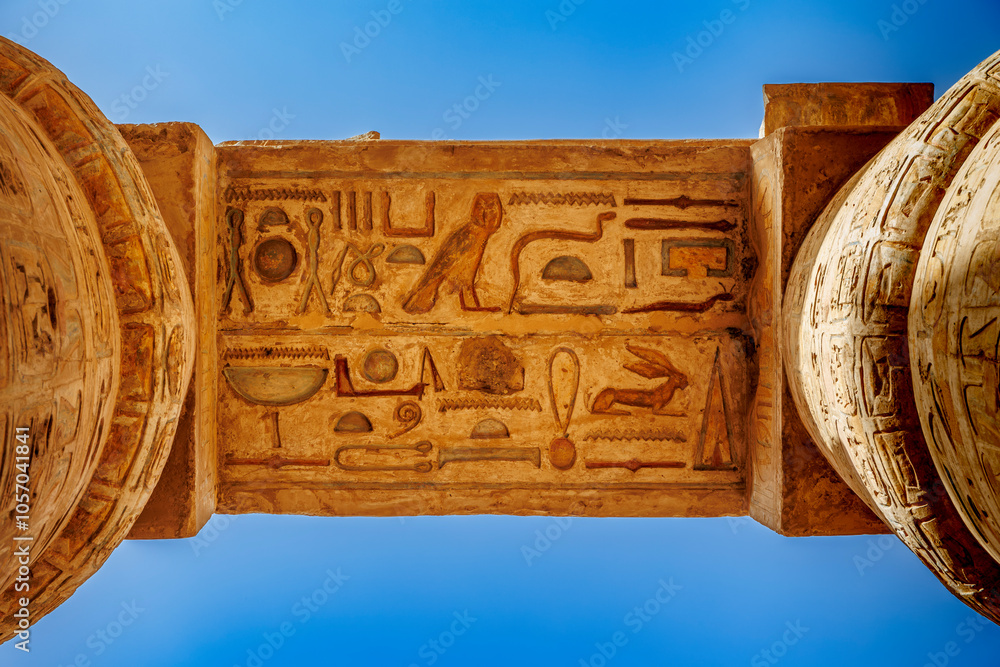 Ancient Egyptian relief features detailed carvings of figures and ...
