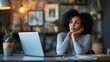 © Aisha - woman working on laptop and thinking