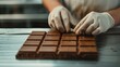 © ธิดารัตน์ ชะโนวรรณะ - Close-up RAW Style of Artisanal dark chocolate bar molding, bean-to-bar process