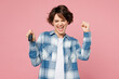© ViDi Studio - Young woman she wear blue shirt white t-shirt casual clothes hold in hand car key fob keyless system do winner gesture isolated on plain pastel light pink background studio portrait Lifestyle concept