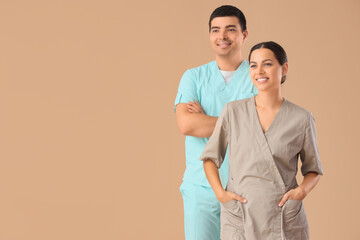 Poster - Massage therapists smiling on beige background