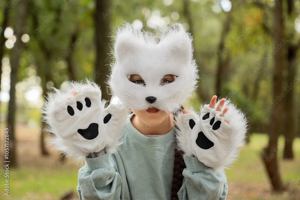 Quadrober girl with cat mask in park, closeup