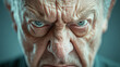 © ABX - Angry elderly man with intense gaze and stern face