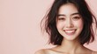 © Chatchanan - Close-up shot of a happy Asian model, half-body, smiling warmly at the camera, solid pastel