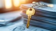 © Kultawatch - Mortgage Documents with Key on Top of Stack