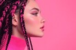 © Marina Shvedak - Beauty portrait of a young woman with vivid pink and black braids wearing pink sweater and makeup, posing on a pink background