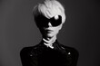 © SHOTPRIME STUDIO - Stylish woman with platinum blonde hair wearing oversized sunglasses and lace gloves, exuding confidence in a dramatic black and white setting.