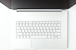 © Vectplus - open laptop computer with blank keyboard resting on a clean white surface, showcasing its screen and keyboard