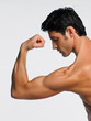 © Designpics - Man Flexing Arm