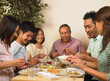 © Designpics - Family Dining Together