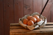 © Westend61 - Organic brown eggs in paper on wooden table
