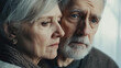 © ABX - Sad elderly couple tender and emotional