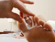 © Designpics - Man's Face framed by Hand and Foot