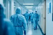 © Guy - Medical Workers in Protective Suits Walking Down a Corridor