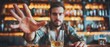 © COK House - Man at bar with drink reaching out, bartender making scotch & soda. Variety of alcohol visible, casual vibe typical of bars.