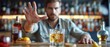 © COK House - Person in bar gestures 'stop' with left hand, holding cocktail with right. Background displays whiskey bottles, foreground lemon wedges.