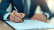 © somchairakin - client is focused on signing important documents with pen