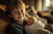 © yevgeniya131988 - A Happy Boy Holding His Newborn Baby Brother at Home