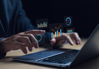 businessman is analyzing data, working with computer using statistical graphs, managing work structu