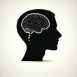 © Olga - A black silhouette of a human face with an image of a brain in the head. Concept of mind, thinking. Illustration