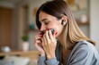 ©  S u n n y B u n n y - Young woman enjoying wireless earbuds in cozy home setting for relaxation and leisure activities.