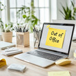© carolina - laptop with a sticky note on the screen reading 'Out of Office.' The bright note stands out against the screen, signaling a break from work or a holiday. Perfect for illustrating office closures,