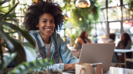 Wall Mural - Businesswoman smiling while working on laptop in trendy coworking space, airy atmosphere