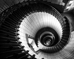 spiral staircase winds its way upwards inside Ile Vierge Lighthouse