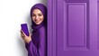 © Chronicles Artsy  - Elegant Hijabi Woman Holding Smartphone in Purple Setting