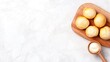 © Svitlana - Delightful cream puffs arranged on a rustic wooden board accompanied by creamy white chocolate on a softly lit table
