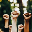 © Tadeusz - Diverse hands raised in solidarity, symbolizing unity and empowerment.