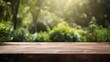 © venusvi - Rustic wooden table with out-of-focus green garden view, ideal for presentations