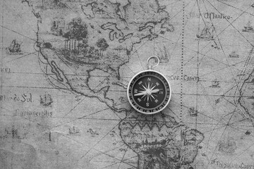 Wall Mural - classic round compass on background of old vintage map of world