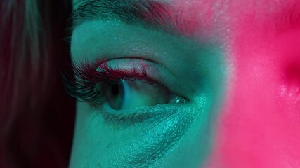 close-up womans blinking eye with long eyelash and contact lens. beauty make up of green eye with ne