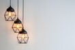 © Marina Demidiuk - Modern black pendant lights with vintage light bulb in a modern house interior. Hanging ceiling light in a white shared office space. Decorative geometric metal lamp. Suspended chandelier loft style