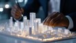 © Photography09 - Property investor consulting with architect, cityscape model in hand, progressive real estate ideas