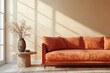 © olegganko - Modern orange sofa with decorative vase and sunlight streaming through the window
