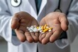 © Iona - A healthcare professional presents various colorful pills in open hands, symbolizing medicine and care.