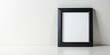 © Chanchai - Minimalist black picture frame on white background.