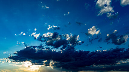 Wall Mural - Beautiful Sunset Sky With Vibrant Clouds and a Tranquil Atmosphere in the Evening