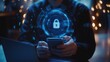 © jakapong - Cybersecurity Professional Using Smartphone with Digital Lock Icon and Holographic Data Protection Elements
