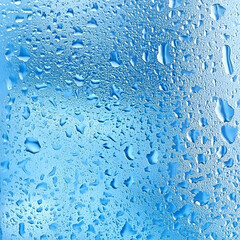 Wall Mural - blue water drops background texture, abstract liquid pattern